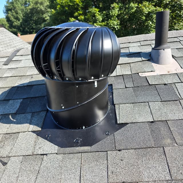 A new turbine vent sealed into new shingles